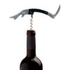 Wooden and steel sommelier corkscrew on a wine bottle