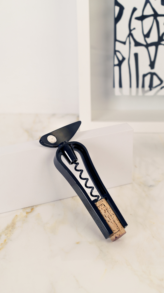black t-shaped corkscrew with cork