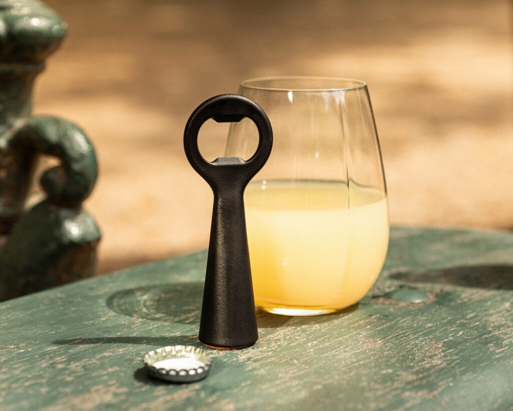 Stainless steel beer bottle opener coated with a PVD skin