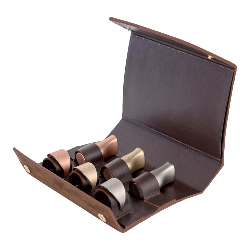 Stopper and rings for wine bottles in leather case