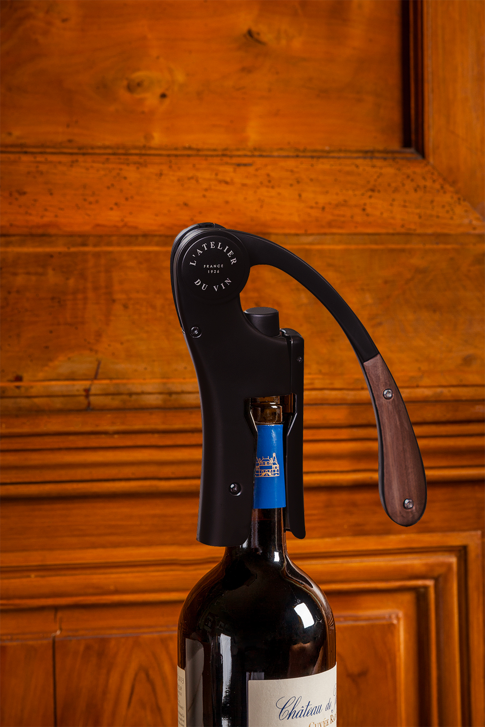 Oeno Motion Wood and black lever corkscrew on bottle 2