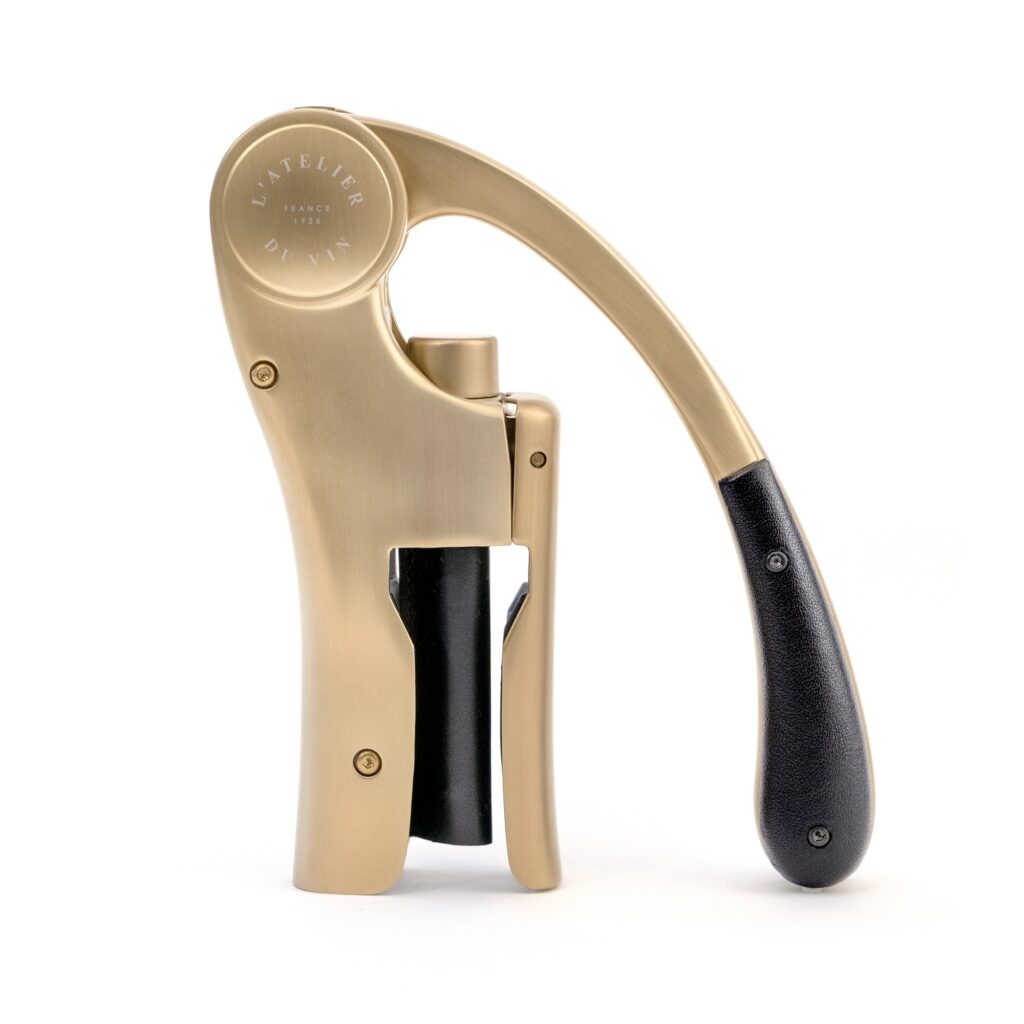 Lever corkscrew in gold with black leather handle