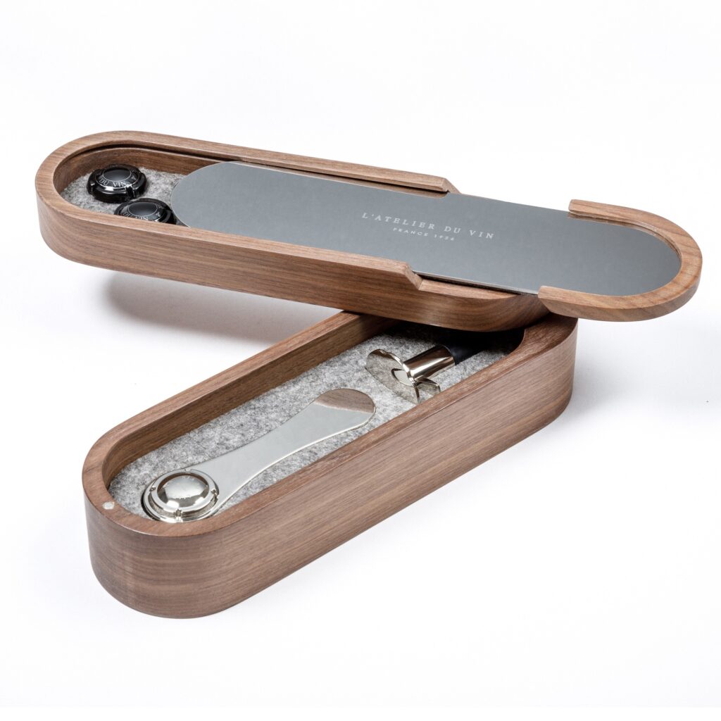 Wooden box with wine accessories cork opener and stopper