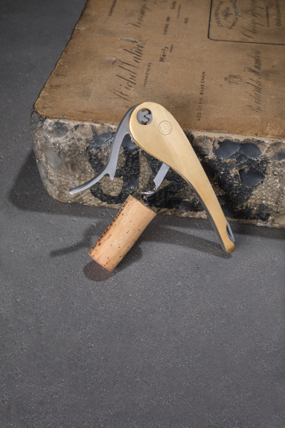 Soft machine brass corkscrew with cork closeup
